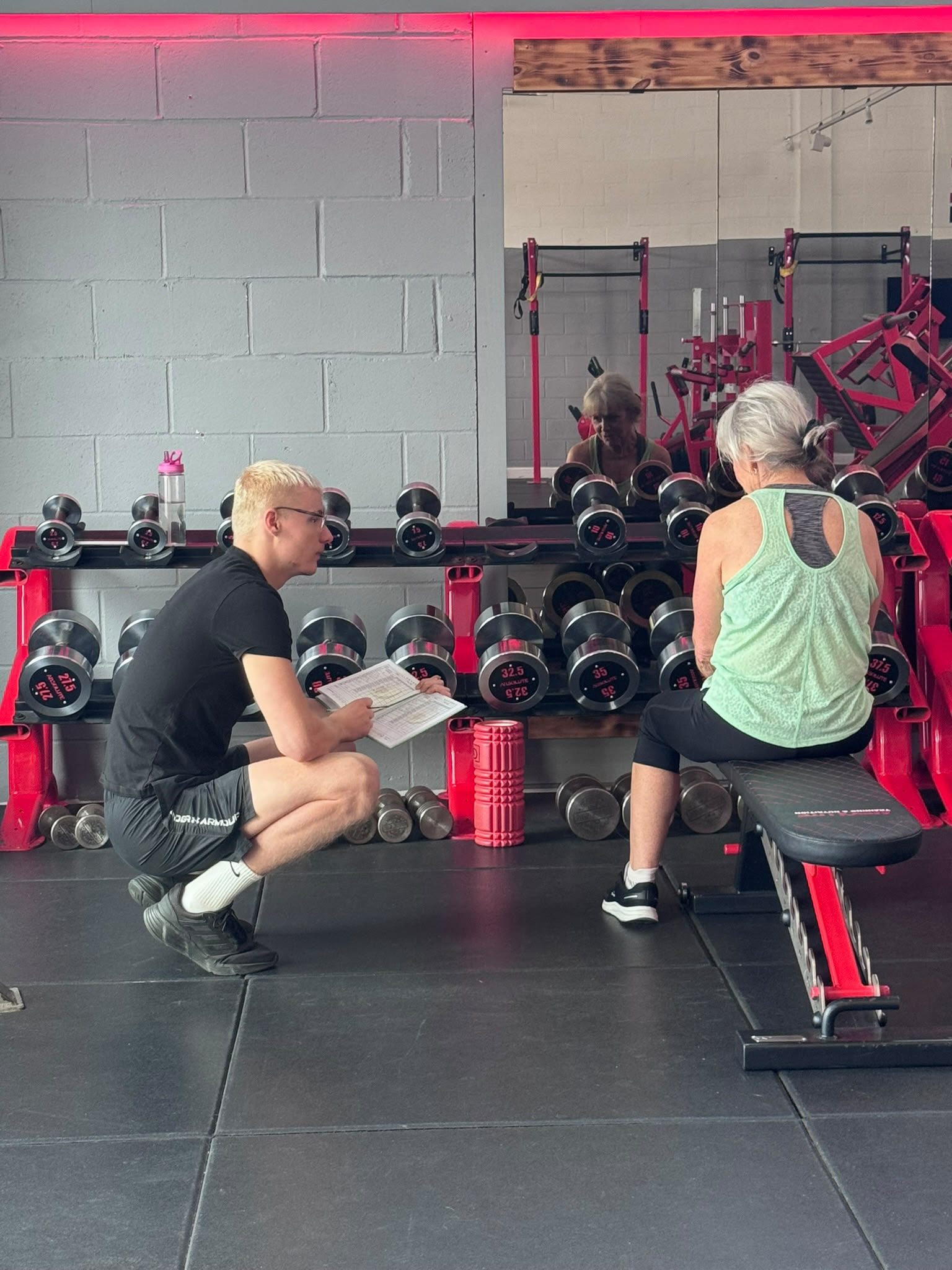 A coach talking a member through her plan