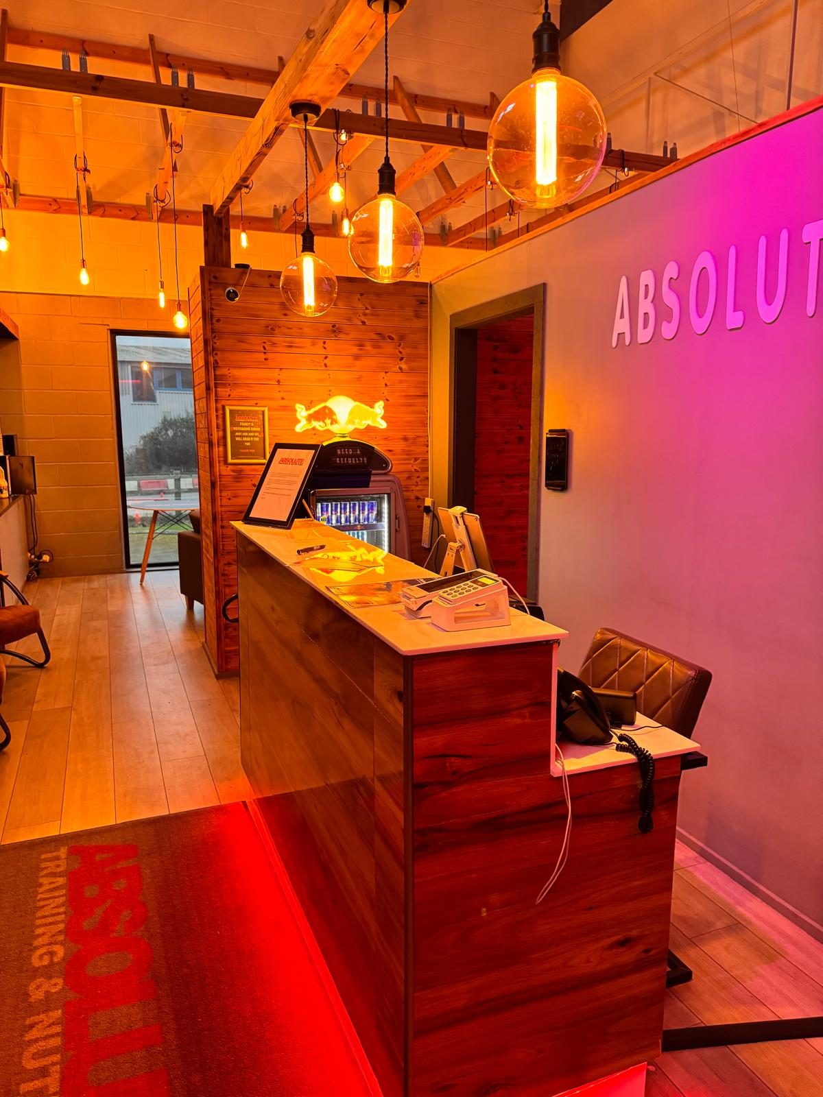 The reception at Absolute, under red and pink light